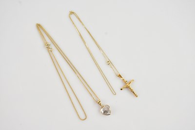 Lot 615 - A yellow metal crucifix pendant on chain,...