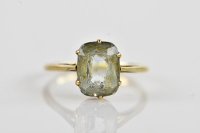 Lot 672 - A yellow metal and pale blue stone set ring,...