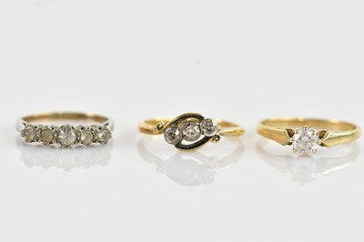 Lot 657 - A 9ct yellow metal cubic zirconia set ring,...
