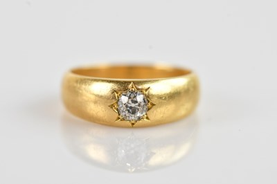Lot 633 - An 18ct gold diamond solitaire ring, gypsy set,...