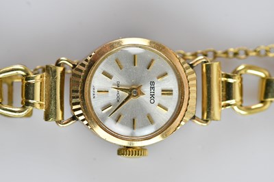Lot 705 - SEIKO; a lady’s 9ct gold wristwatch, stamped...