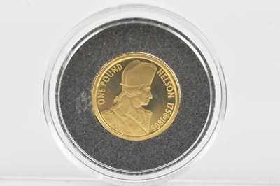 Lot 1035 - An Alderney gold £1 coin, 2005, the reverse...
