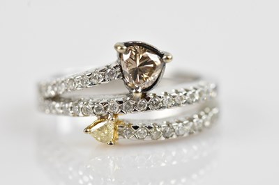 Lot 2283 - A white metal diamond set double band dress...