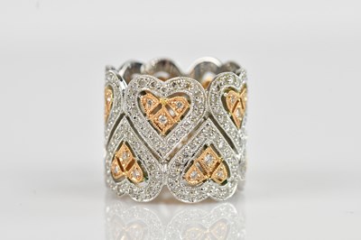 Lot 2290 - A white and yellow metal diamond set band, set...