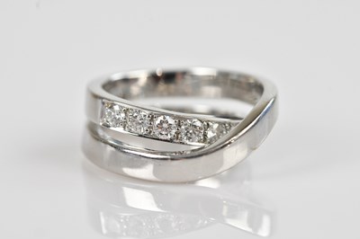 Lot 2268 - A white metal asymmetrical diamond set dress...