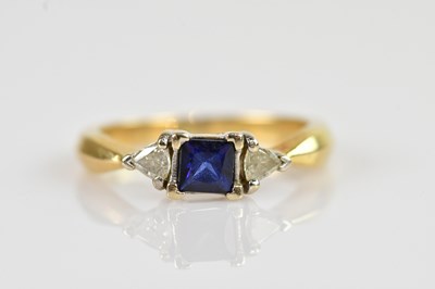 Lot 2284 - An 18ct yellow gold diamond and sapphire dress...