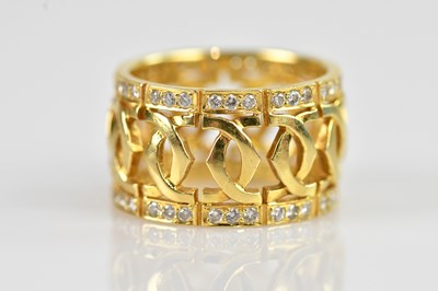 Lot 2285 - A yellow metal diamond set band, with pierced...