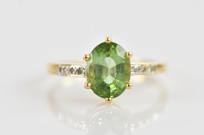 Lot 648 - An 18ct yellow gold and tourmaline ring, set...