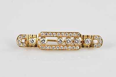Lot 1265 - A yellow metal diamond set bar brooch, set...