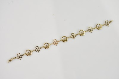 Lot 596 - A 9ct gold bracelet, with links modelled as...