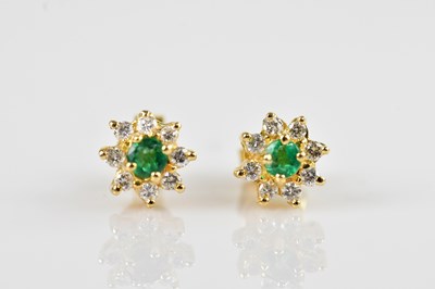 Lot 1393 - A pair of yellow metal diamond set cluster...