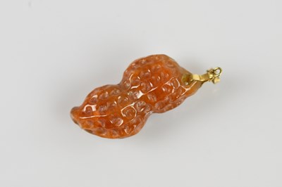Lot 2122 - A yellow metal mounted carved hardstone...