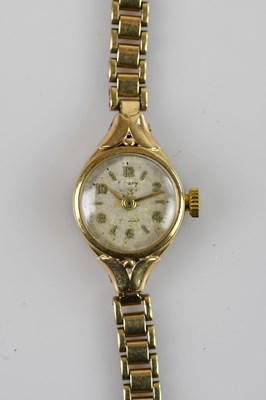 Lot 1155 - A 9ct gold lady's wristwatch with bracelet...