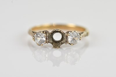 Lot 2582 - A 9ct yellow gold three stone dress ring (one...