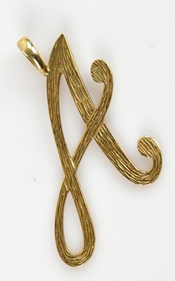 Lot 2214 - A 9ct yellow gold pendant in the form of the...