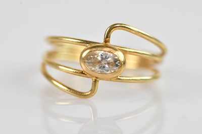 Lot 2500 - A yellow metal dress ring stamped '750', with...