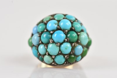 Lot 2583 - A yellow and white metal turquoise set bombé...