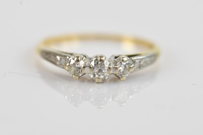 Lot 2559 - A yellow and white metal diamond illusion set...