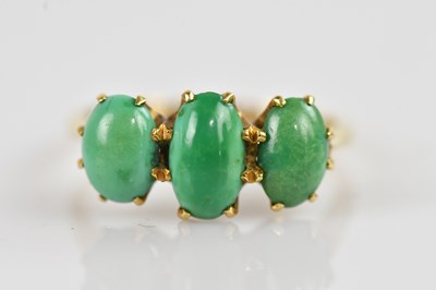 Lot 2501 - A yellow metal turquoise set three stone dress...