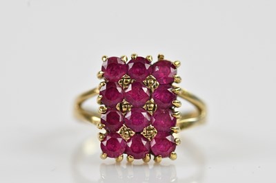 Lot 2354 - A yellow metal dress ring, set with twelve...