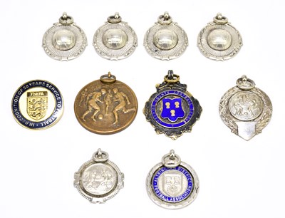 Lot 201 - FOOTBALL INTEREST; eight silver medallions,...