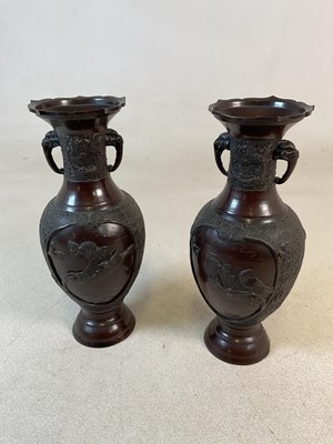 Lot 423 - A pair of Japanese Meiji period bronzed twin...