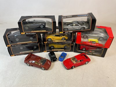 Lot 203 - BURAGO; eight boxed diecast cars, two unboxed...