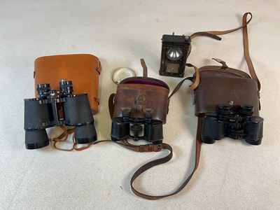 Lot 86 - Three sets of binoculars to include two Ross...