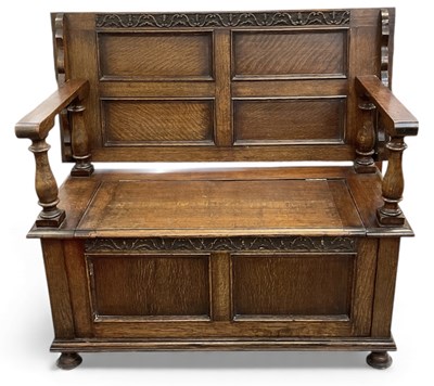 Lot 73 - An early 20th century oak monk's bench, with...