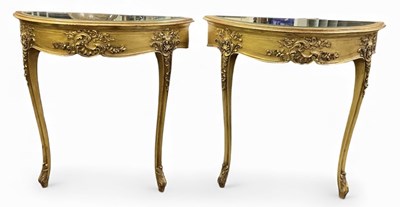 Lot 72 - A pair of modern mirrored glass topped gilt...