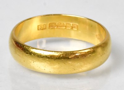 Lot 1127A - A 22ct yellow gold wedding band, size P,...
