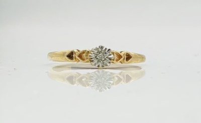 Lot 781 - A 9ct yellow gold ring set with tiny diamond...
