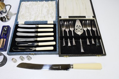 Lot 2501 - A pair of silver handled hair curlers, in...