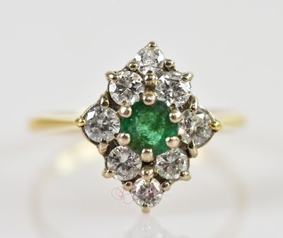 Lot 2385 - An 18ct yellow gold diamond and emerald...