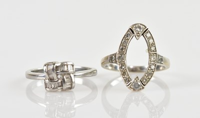 Lot 2386 - A platinum diamond set dress ring, set with...