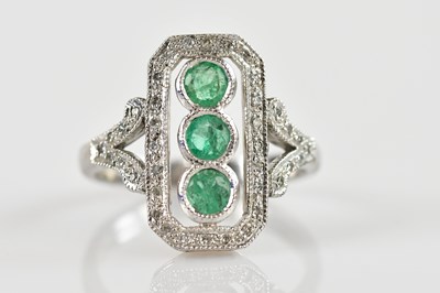 Lot 2511 - A 9ct white gold diamond and emerald Art Deco...
