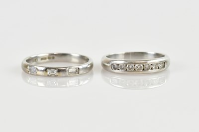 Lot 2468 - A platinum diamond set three stone band, size...