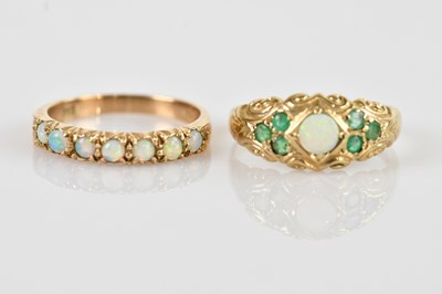 Lot 2555 - A 9ct yellow gold opal set seven stone dress...