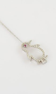 Lot 2189 - A white metal diamond set pendant formed as a...