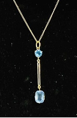 Lot 772 - A 9ct yellow gold two stone drop pendant,...