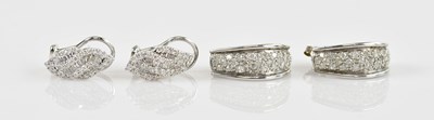 Lot 1396 - A pair of white metal diamond set earrings,...