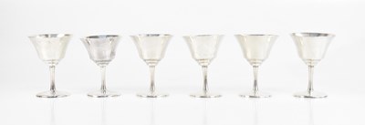 Lot 239 - A set of six sterling silver wine glasses,...
