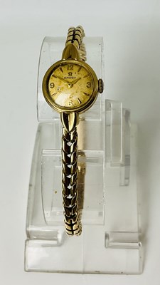 Lot 808 - OMEGA; a lady's vintage 9ct gold wristwatch,...