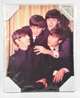Lot 30 - THE BEATLES; a decorative canvas print, 50 x...