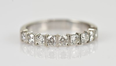 Lot 2357 - A white metal diamond set nine stone dress...