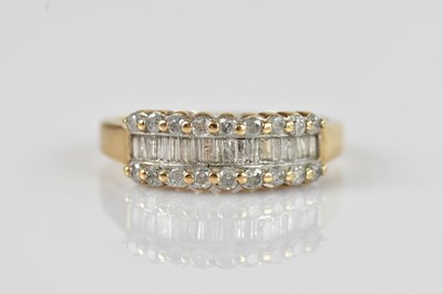 Lot 2340 - A 9ct yellow gold diamond set dress ring, set...