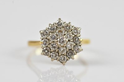Lot 2309 - An 18ct yellow gold diamond cluster ring, set...