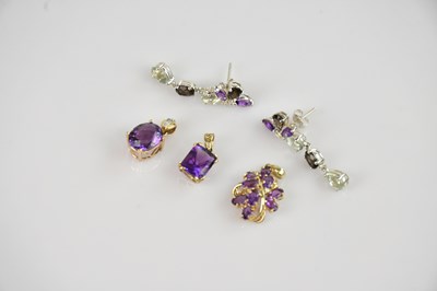 Lot 2210 - Three 9ct yellow gold amethyst set pendants,...