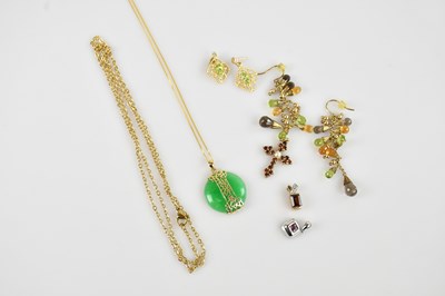 Lot 2209 - A Chinese 9ct gold and green hardstone pendant,...