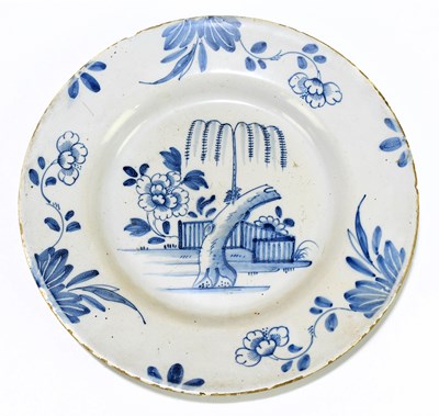 Lot 567 - An 18ct century English Delftware plate...